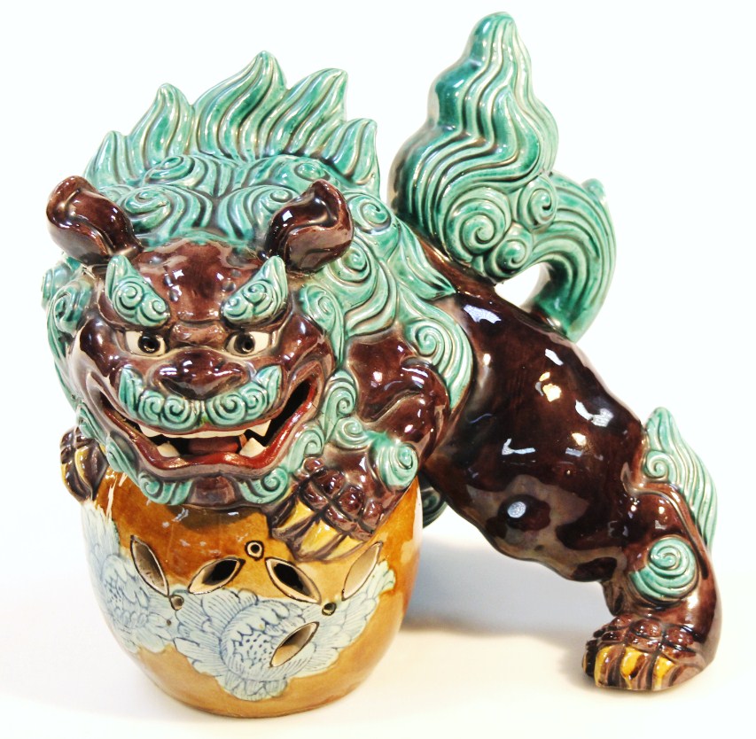 Appraisal: A thC Chinese pottery Dog of Fo resting on an