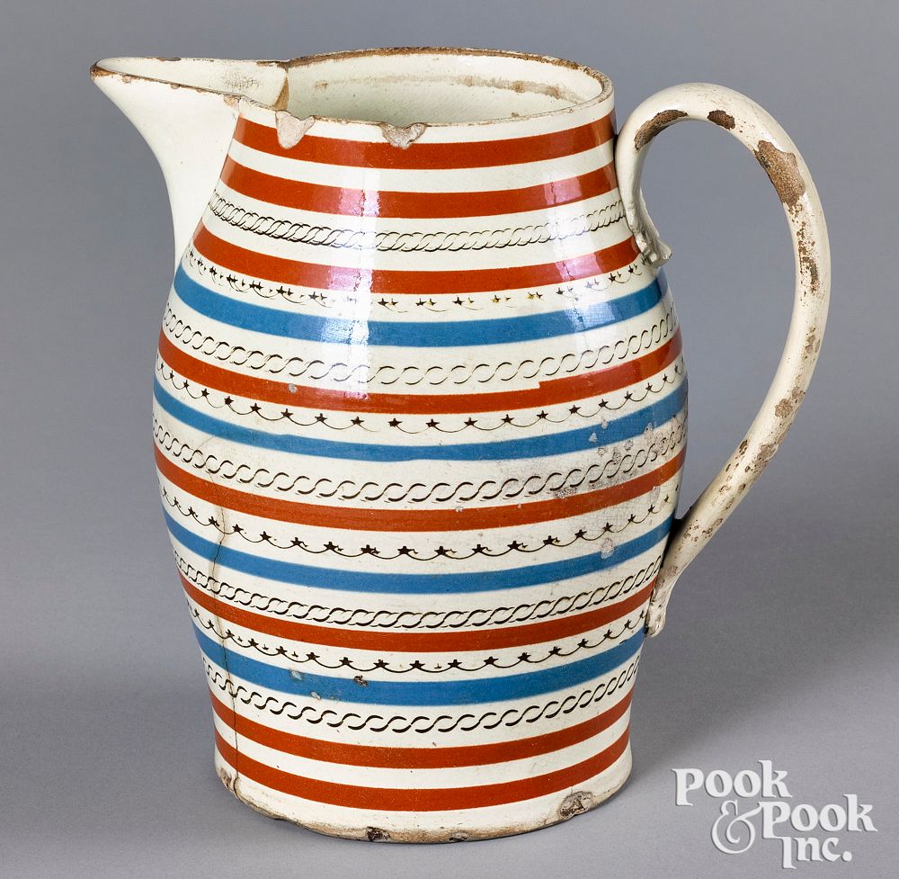 Appraisal: Mocha pitcher Mocha pitcher with tan blue star and loop