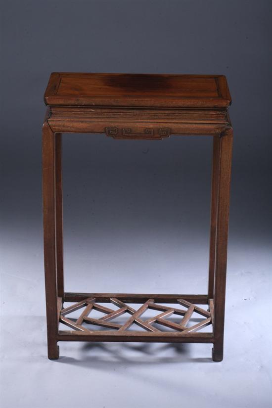 Appraisal: CHINESE HUANGHUALI STAND Qing Dynasty The rectangular top above a