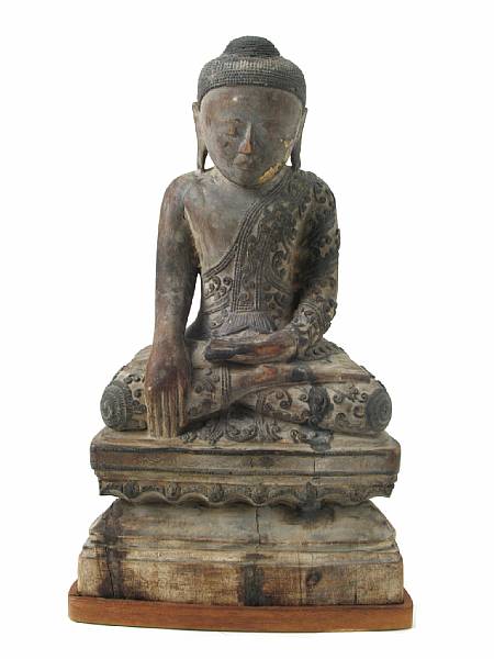 Appraisal: A Burmese wood seated figure of a Buddha on a