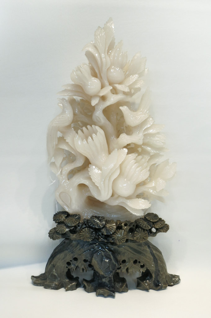 Appraisal: CHINESE CARVED HARDSTONE TREE depicting birds in a flowering white