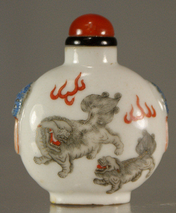 Appraisal: porcelain Dao Quang snuff bottle foo dogs frolicking shoulder with