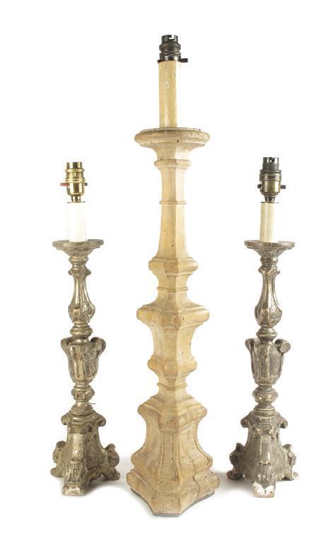 Appraisal: A pair of Italian carved silvered-wood altar table lamps