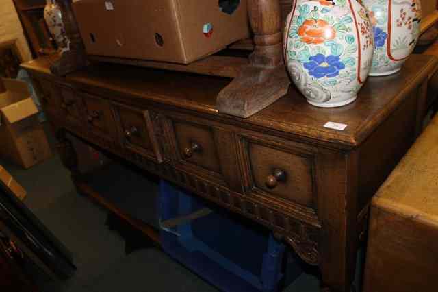 Appraisal: AN REPRODUCTION TH CENTURY STYLE OAK DRESSER fitted with an