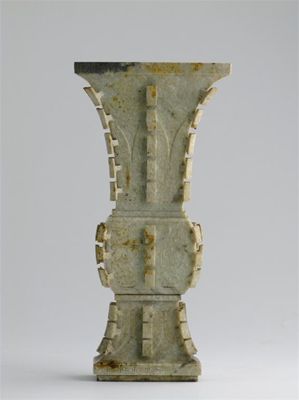 Appraisal: A Chinese chicken skin jade gu-form vase modelled after an