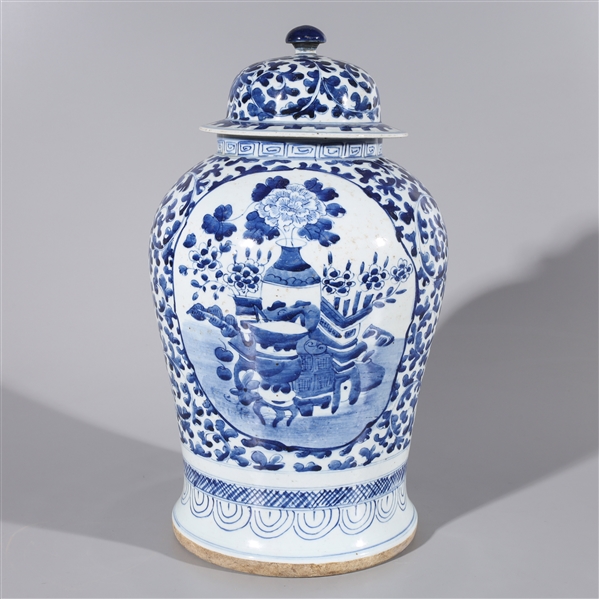 Appraisal: Chinese porcelain blue and white covered vase with floral foliage