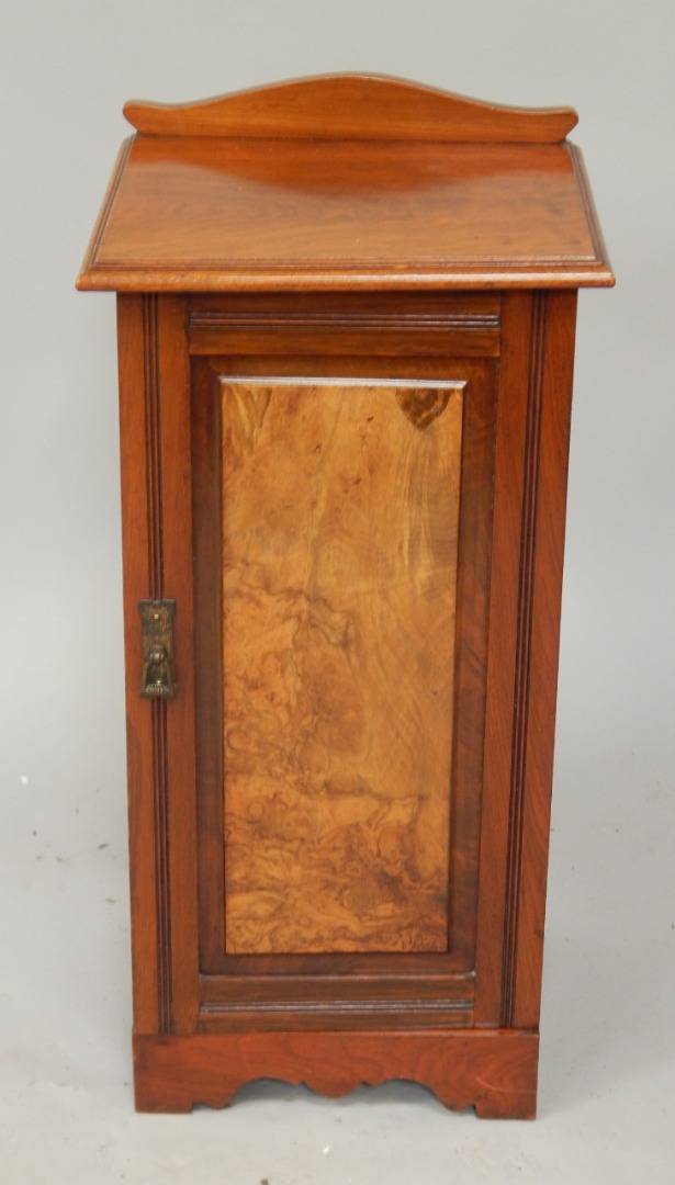 Appraisal: A late Victorian walnut pot cupboard enclosed by a single