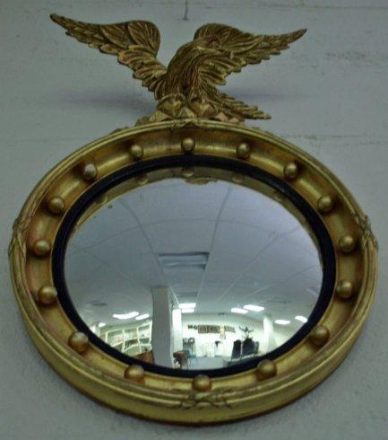 Appraisal: A Regency gilt circular convex wall mirror with ball studded