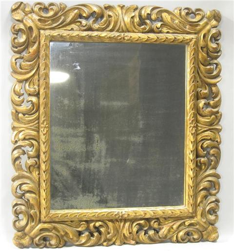 Appraisal: BAROQUE STYLE GILTWOOD AND COMPOSITION MIRROR Paper label on reverse