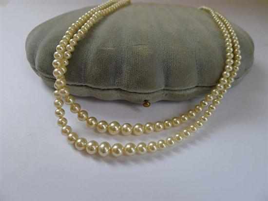 Appraisal: A DOUBLE STRAND OF FAUX PEARLS