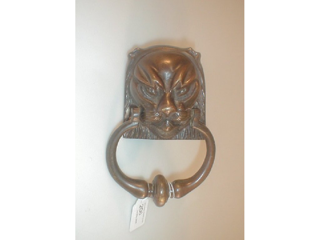 Appraisal: A Cast Bronze Door Knocker modelled as a griffon mask