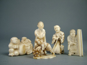 Appraisal: A Japanese netsuke depicting a boy with a dog and