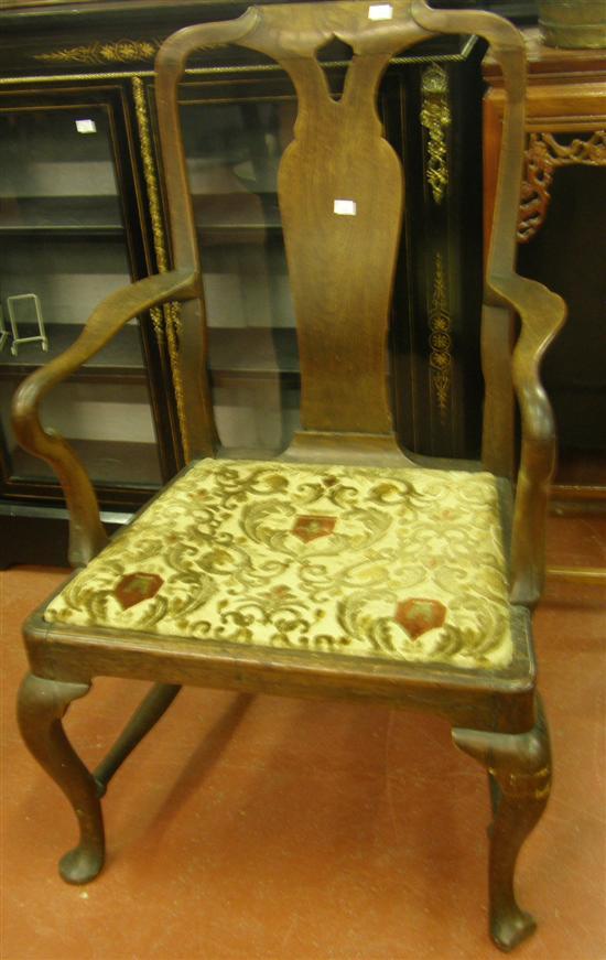 Appraisal: A GEORGE I WALNUT OPEN ARMCHAIR on cabriole legs and