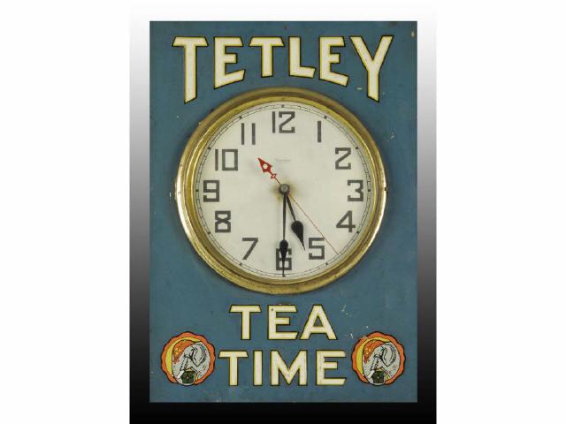 Appraisal: Tetley Tea Embossed Tin Wooden Clock Description s to s