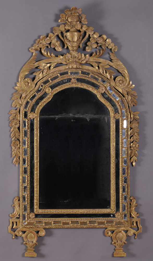 Appraisal: ITALIAN NEOCLASSICAL CARVED GILTWOOD MIRROR The serpentine-top two-part main plate