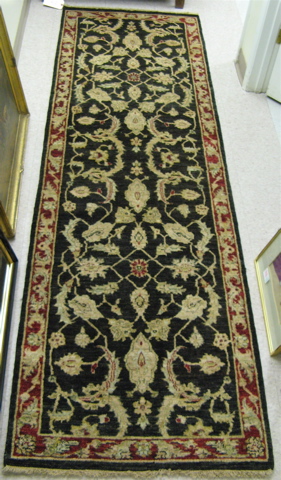 Appraisal: HAND KNOTTED ORIENTAL RUNNER Pakistani-Persian Zeigler design overall floral decoration