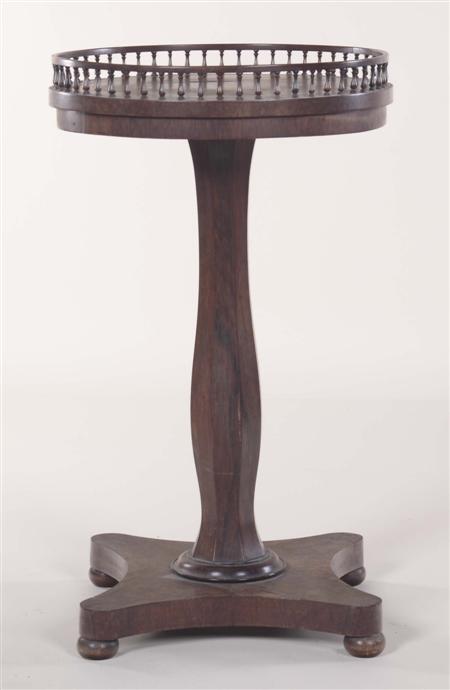 Appraisal: A Regency circular rosewood occasional table the baluster turned gallery