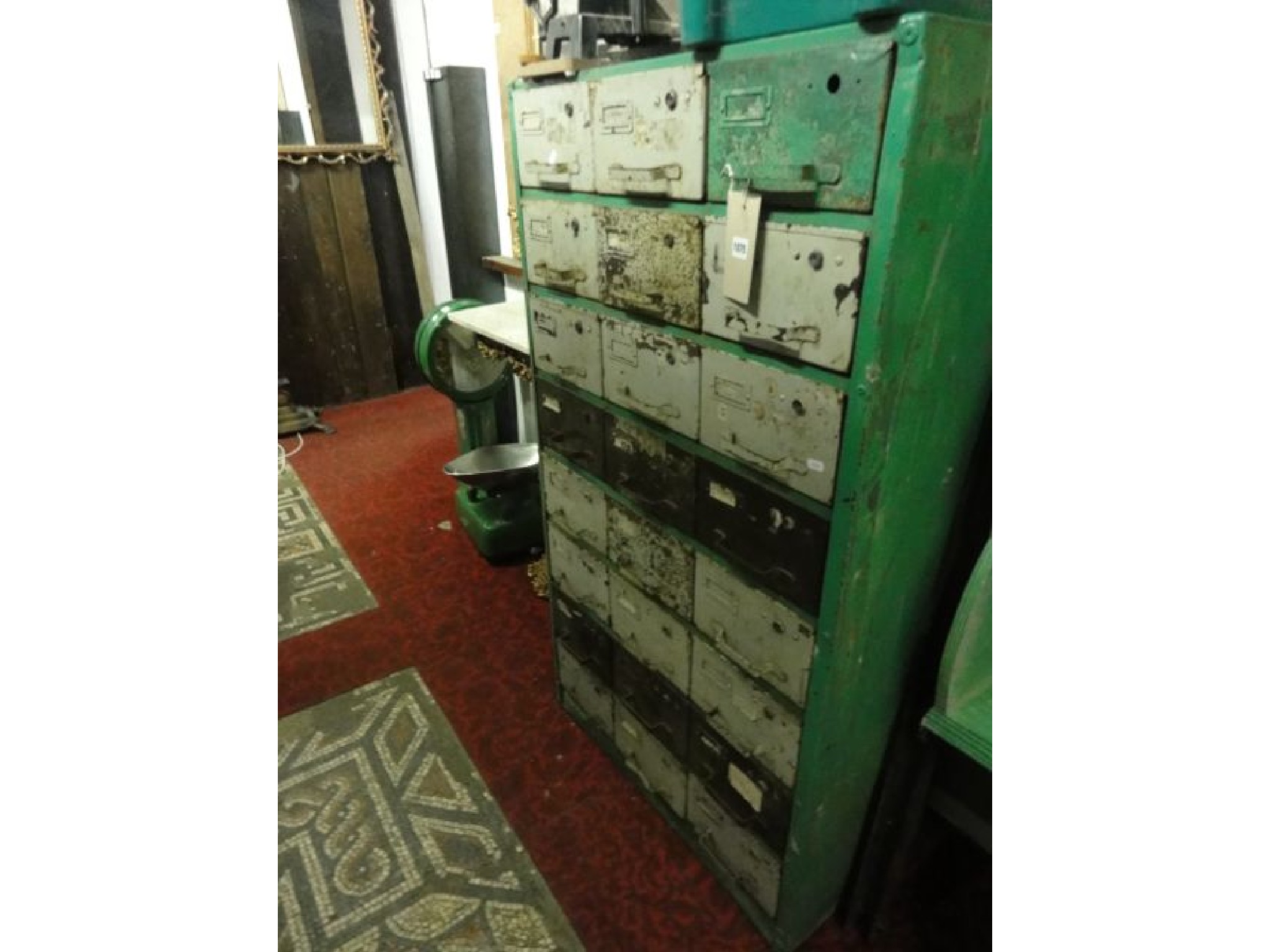 Appraisal: A vintage industrial steel chest fitted with twenty four small