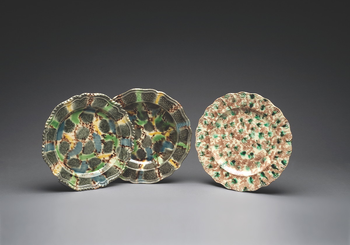 Appraisal: TWO STAFFORDSHIRE CREAMWARE TORTOISESHELL-GLAZED PLATES AND A SOUP PLATE CIRCA