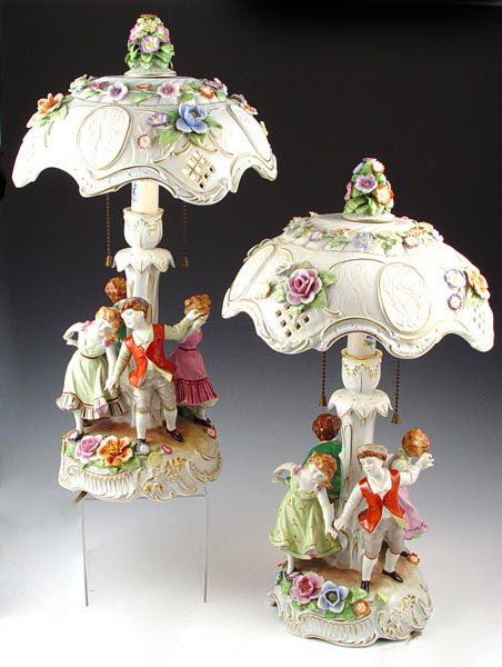 Appraisal: PAIR SCHIERHOLZ GERMAN PORCELAIN FIGURAL LAMPS WITH LITHOPANE SHADES Figural