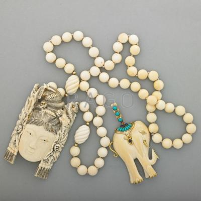 Appraisal: TWO PIECES IVORY JEWELRY ca Carved elephant pendant with diamond