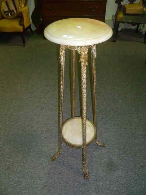 Appraisal: A BRASS FRAMED JARDINIERE STAND of stylised form with applied