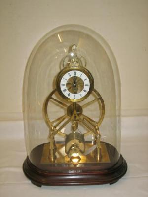 Appraisal: A BRASS GREAT WHEEL SKELETON CLOCK the single fusee movement