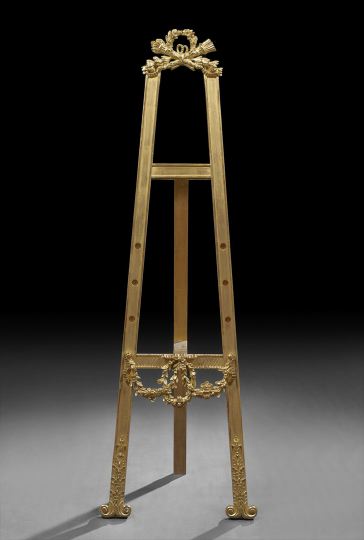 Appraisal: Louis XVI-Style Giltwood Easel of hinged construction surmounted by a