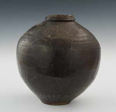 Appraisal: A Large Glazed Pottery Storage Jar Provincial style dark brown