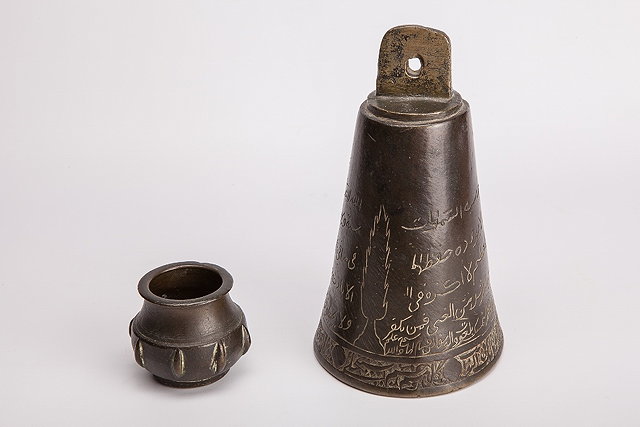 Appraisal: A BRONZE BELL with Arabic inscription cm high and a