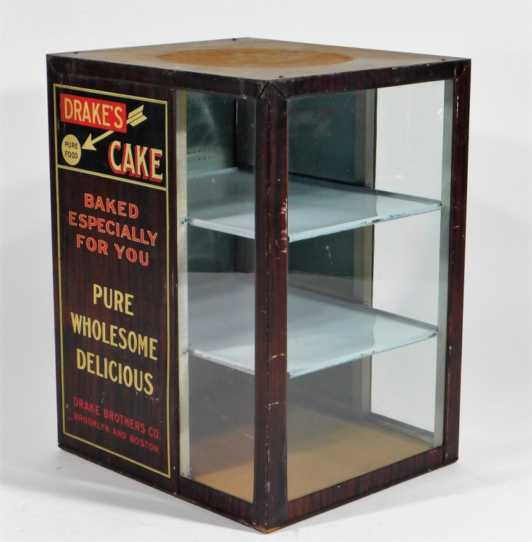 Appraisal: DRAKE'S CAKE COUNTRY STORE ADVERTISING CABINET United States - Grain