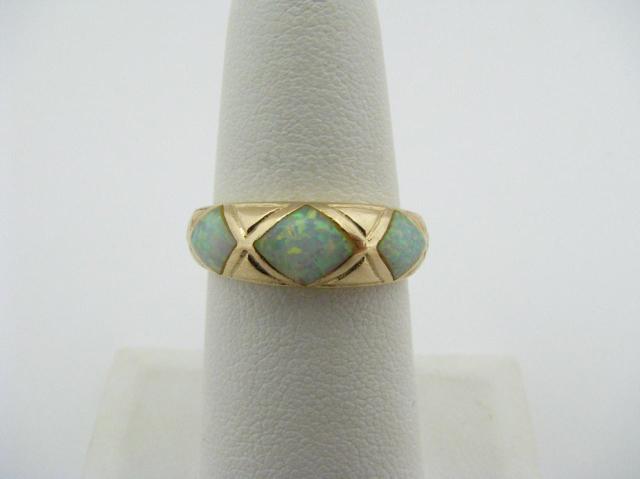 Appraisal: K Yellow Gold dome ring with three opals dwt