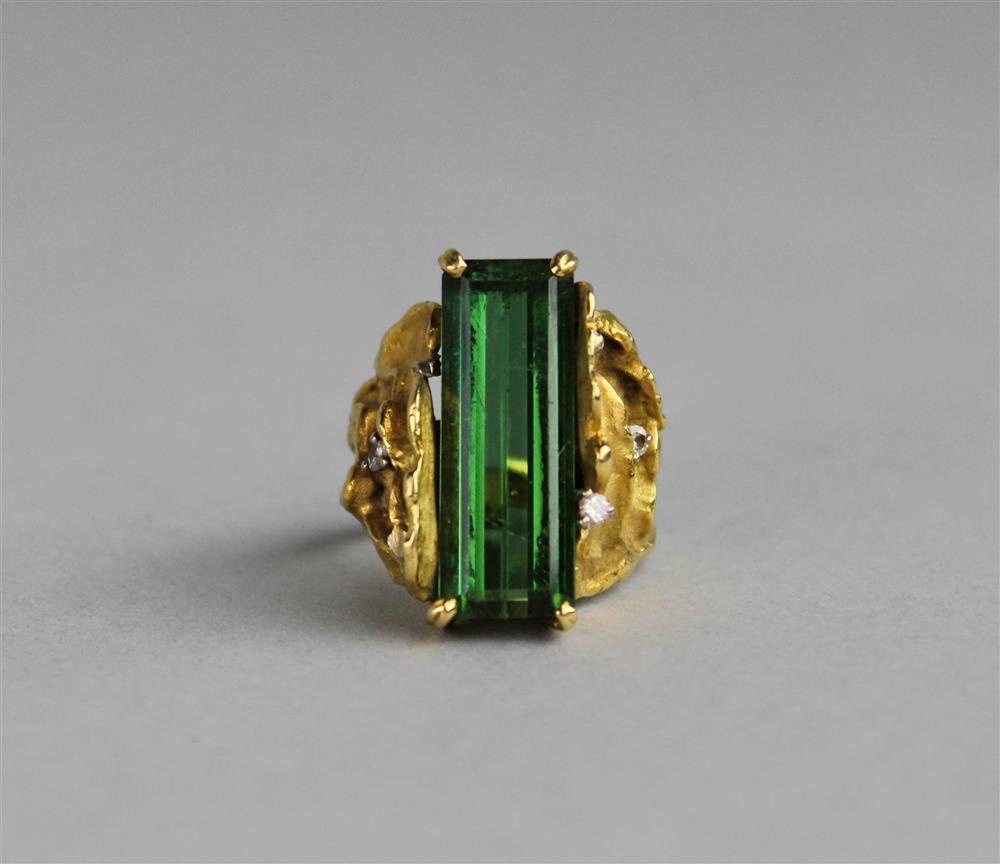 Appraisal: K GOLD HANDWROUGHT RING SET WITH AN EMERALD CUT TOURMALINE