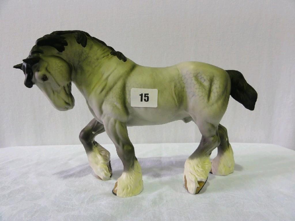 Appraisal: A Beswick matt glazed model of a trotting dappled grey