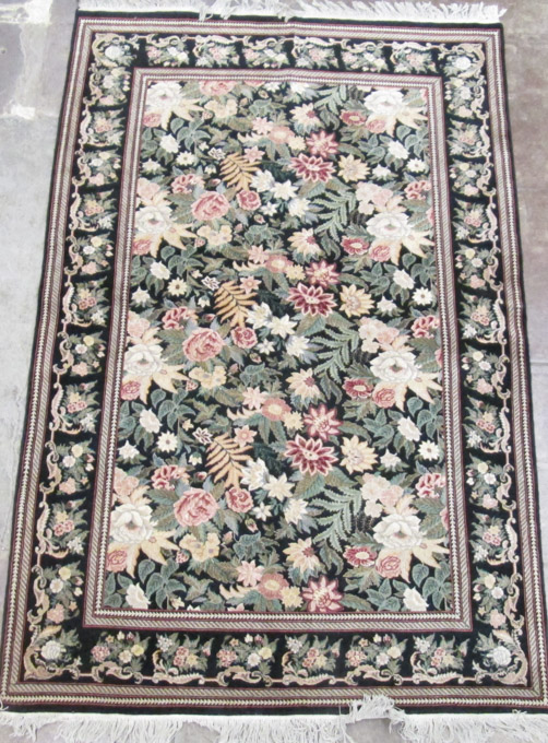 Appraisal: HAND KNOTTED ORIENTAL CARPET Pakistani-Persian overall foliate design on black