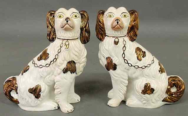 Appraisal: Pair of th c Staffordshire seated copper luster and white