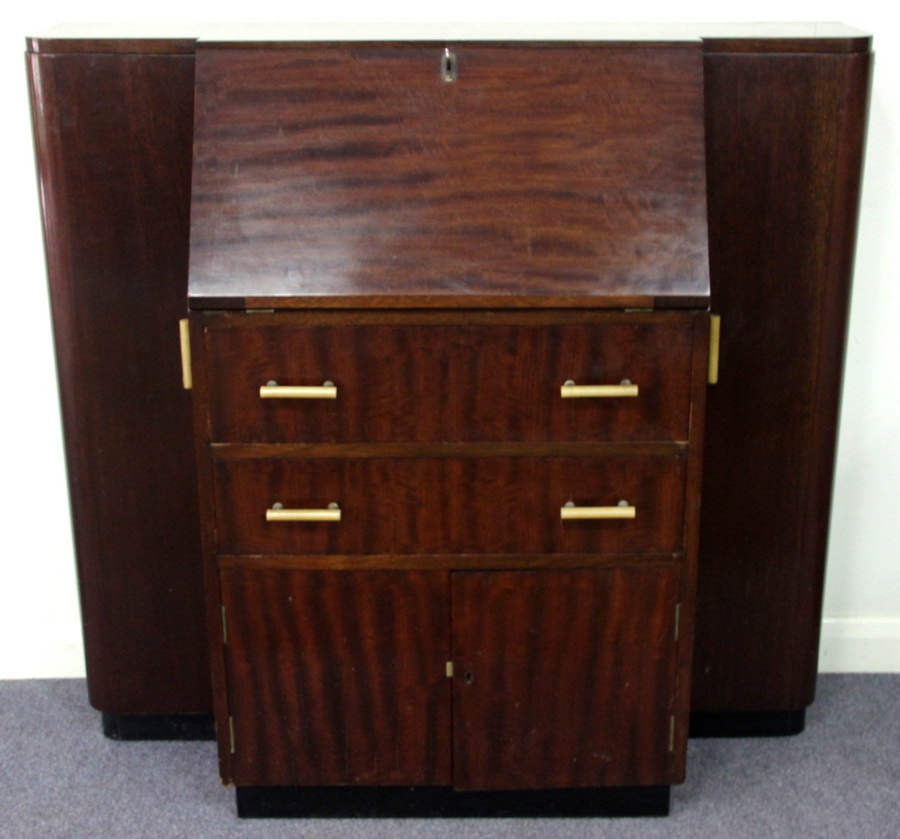 Appraisal: An Art Deco Style mahogany bureau drinks cabinet fitted drawers