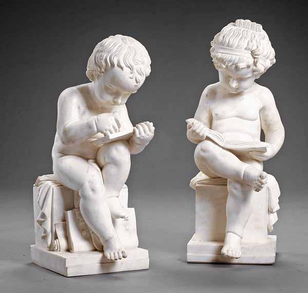 Appraisal: A Pair of Carved White Marble Putti each depicted writing