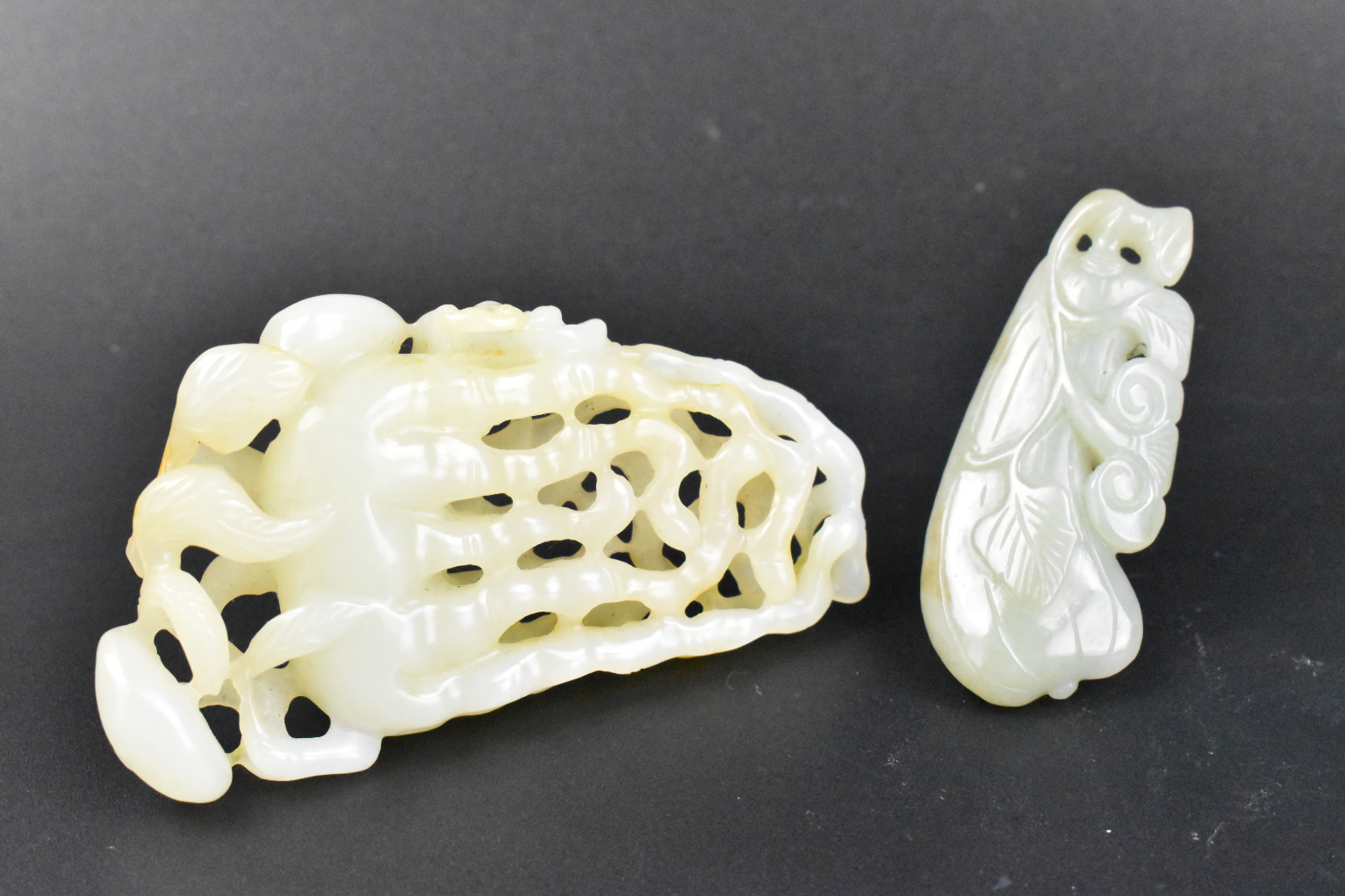 Appraisal: Two Chinese jade carved toggles one a light green and