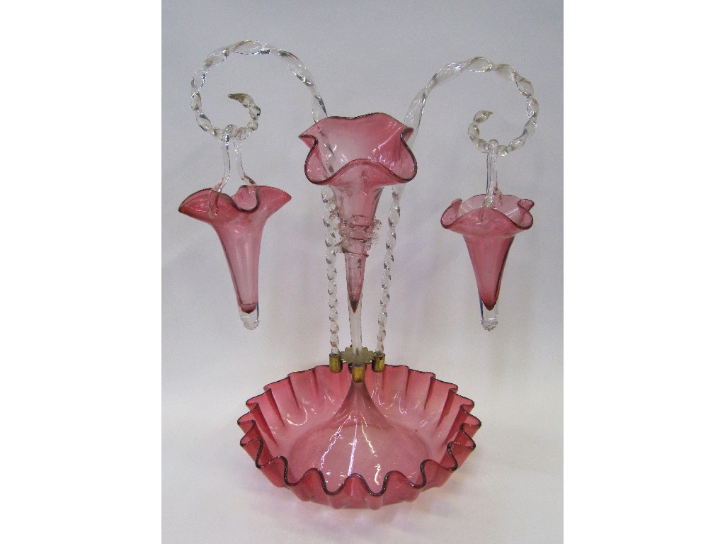 Appraisal: Cranberry glass epergne with barley twist stems and hanging baskets