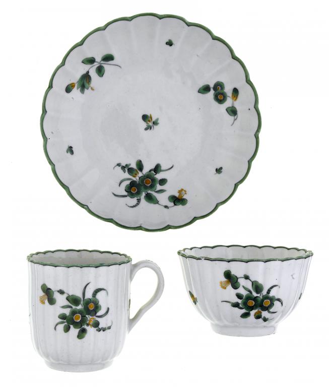 Appraisal: A FIRST PERIOD WORCESTER FLUTED TRIO enamelled in green monochrome