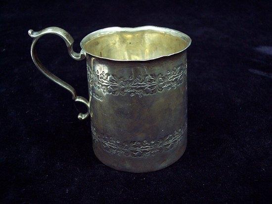 Appraisal: An engraved christening mug with C scroll handle monogrammed and