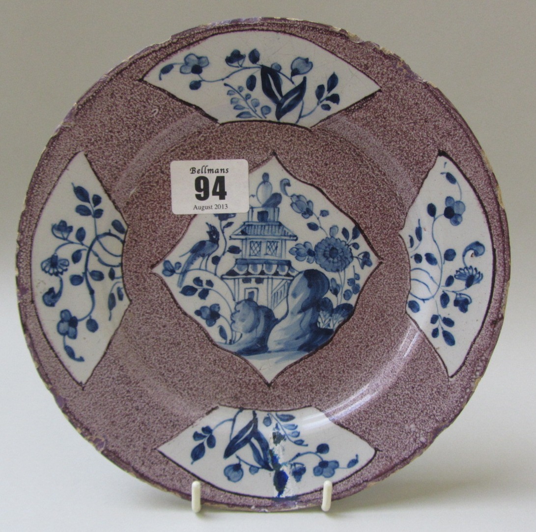 Appraisal: A small English delftware manganese ground plate mid th century