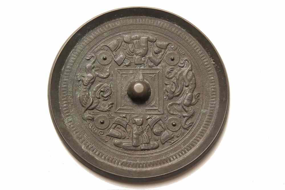 Appraisal: CHINESE BRONZE HAND MIRROR - Ming Period Embossed Bronze Mirror