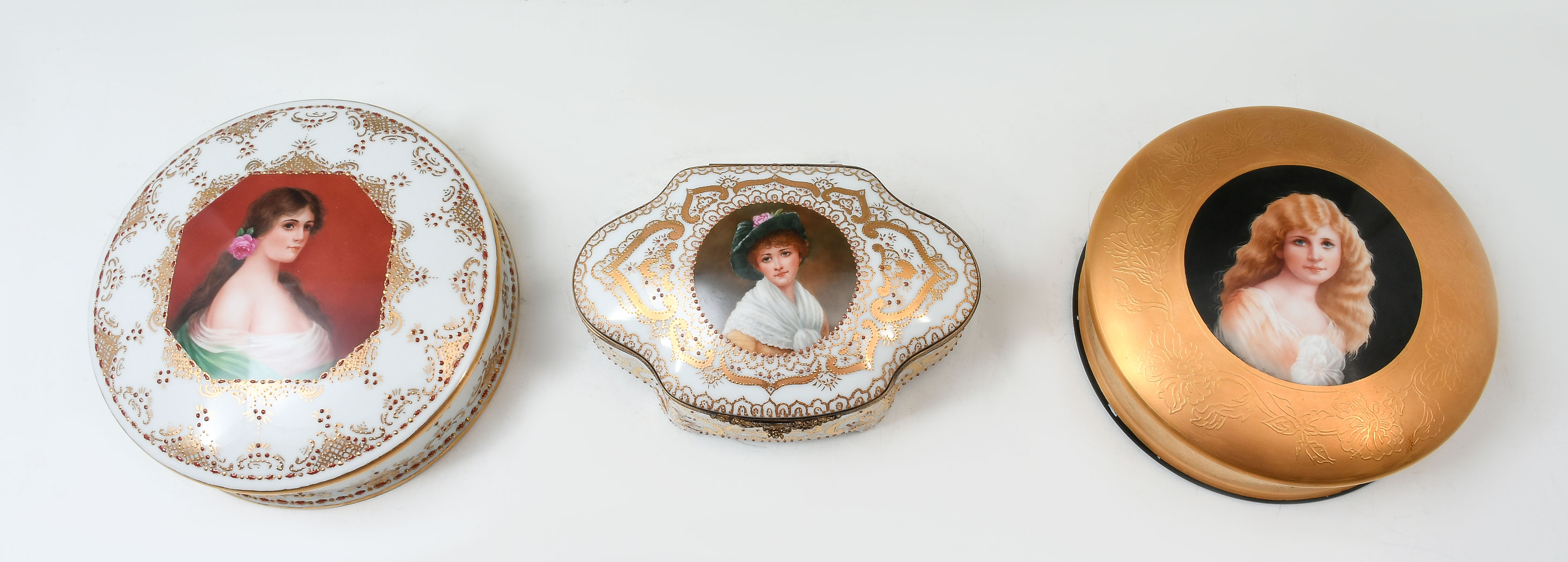 Appraisal: THREE CAROLE SCOTT PAINTED PORCELAIN DRESSER BOXES Young Blond Child