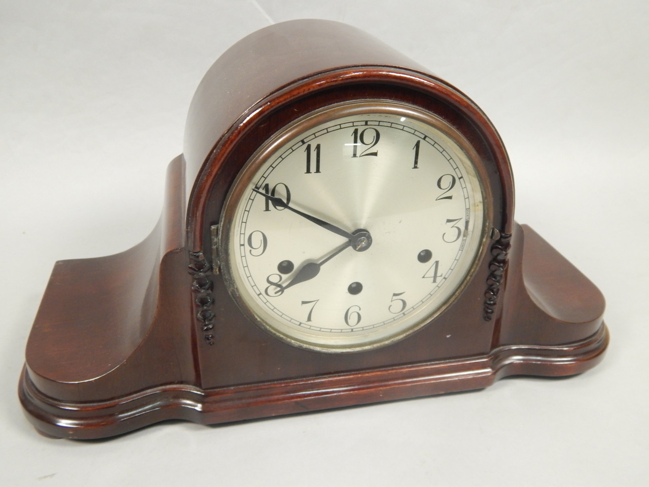 Appraisal: A 's mahogany veneered Napoleon's hat type mantel clock with