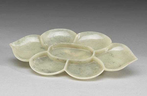 Appraisal: A celadon nephrite floriform condiment dish Thinly carved in the