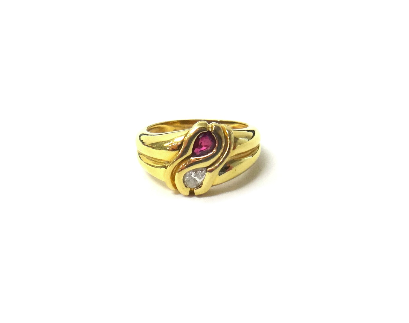 Appraisal: A gold ruby and diamond set two stone ring mounted