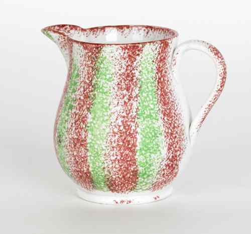 Appraisal: Red and green rainbow spatter creamer th c h Provenance