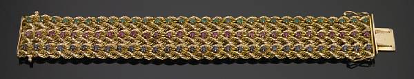 Appraisal: A ruby emerald sapphire and k gold wide braided flexible